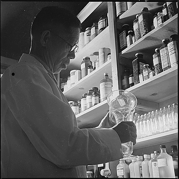 National Archives:  Pharmacist preparing a prescription (ca 1943)